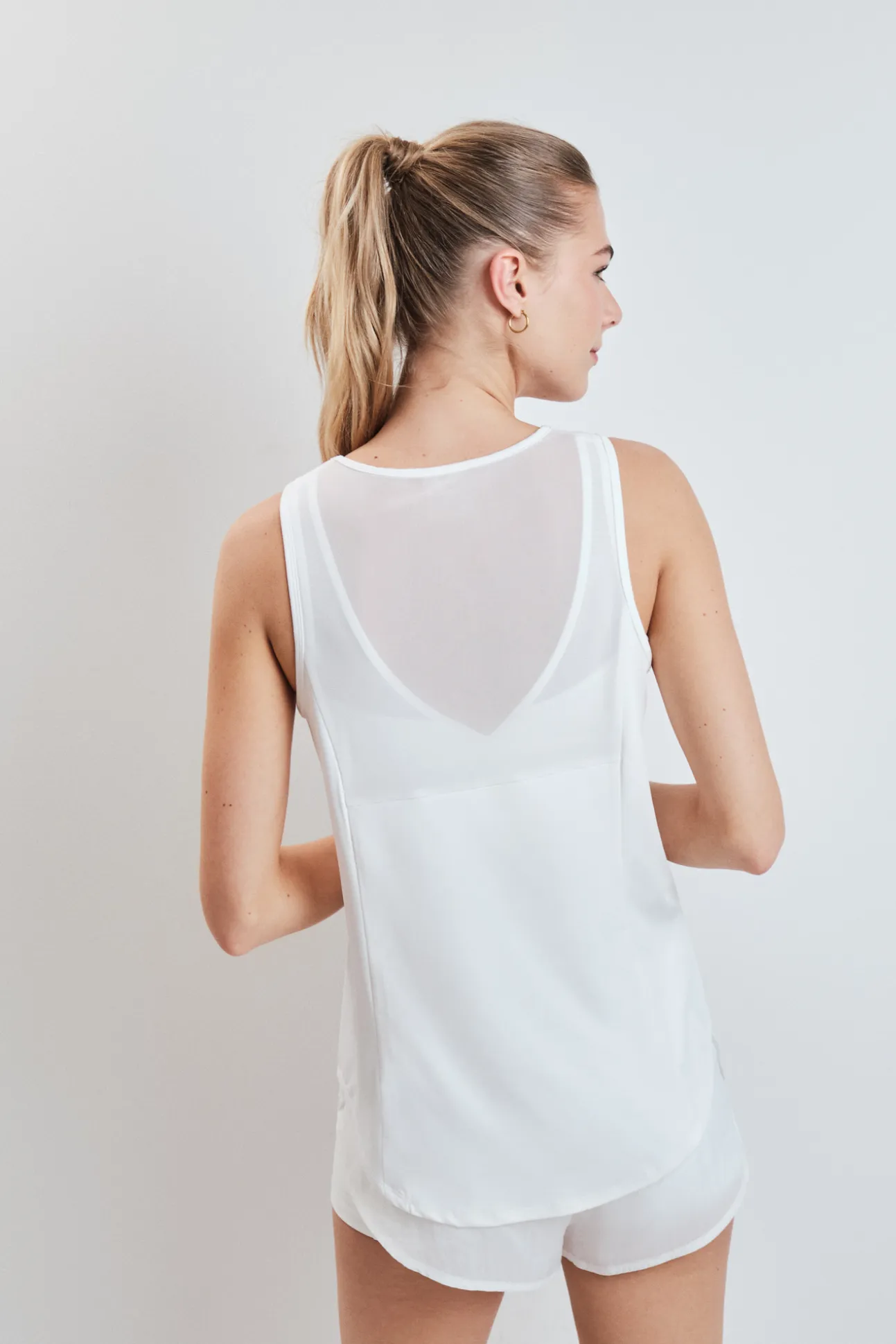 Camiseta técnica halter sin mangas blanca
