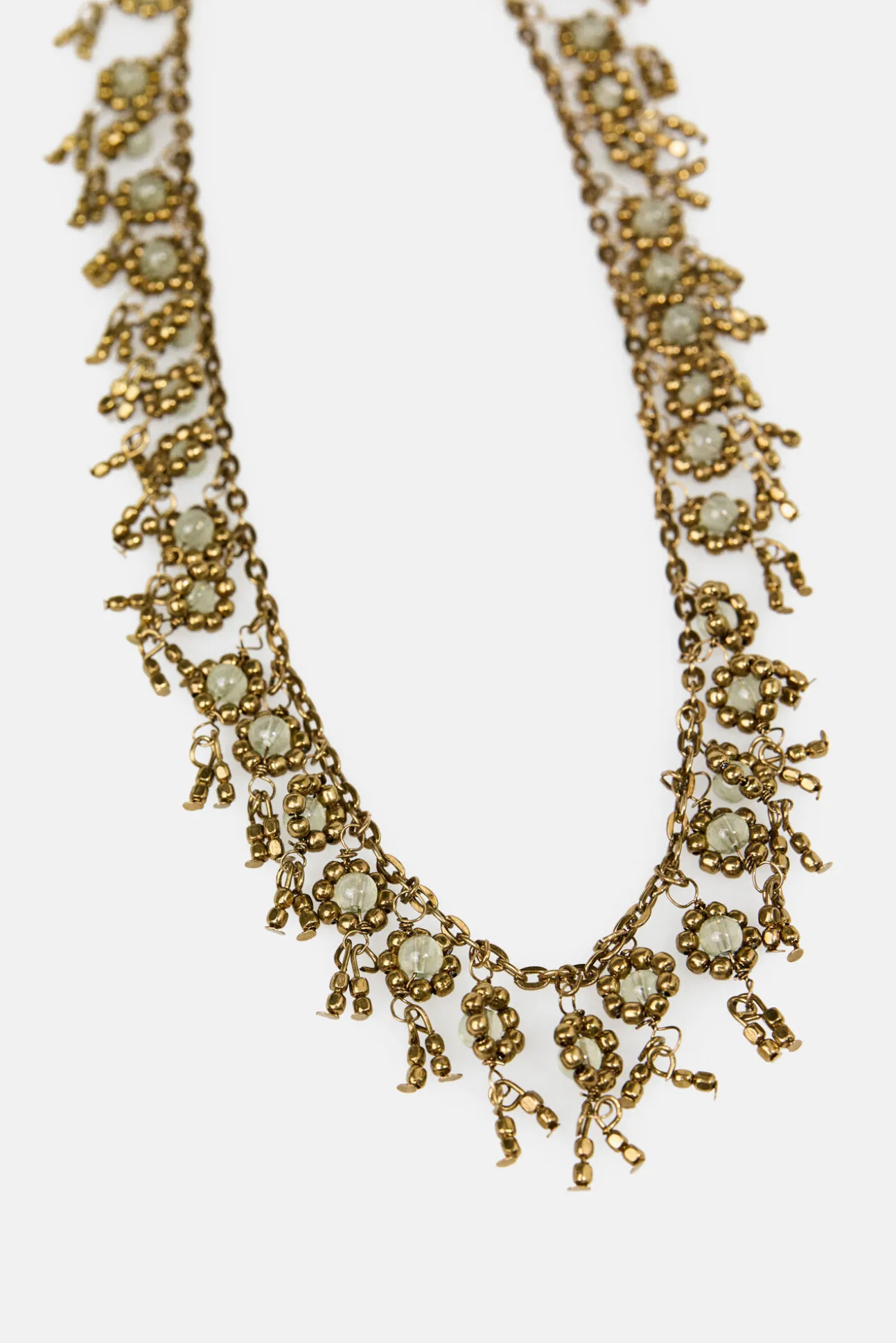 Lubna. Collar corto flores bañado en oro