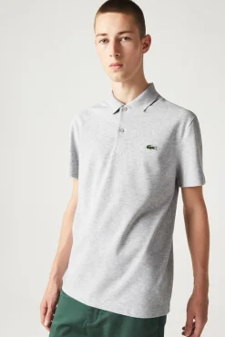 Polo con bordado de cocodrilo pespunteado